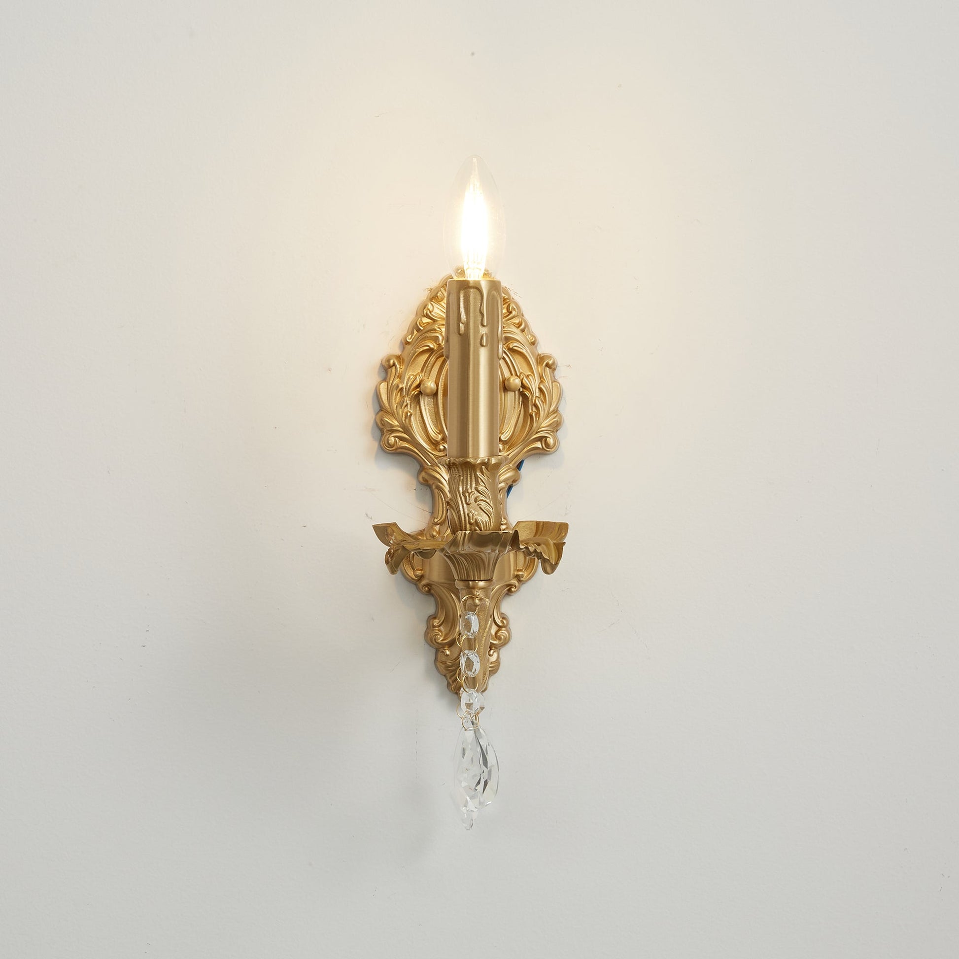 The sconce shown with a candelabra bulb installed.