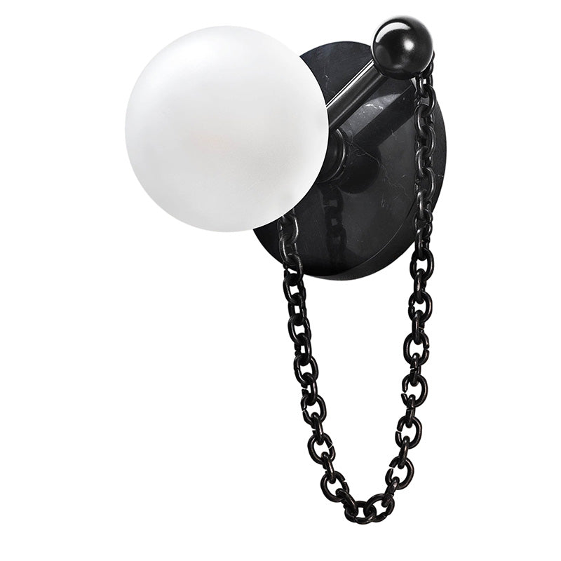 The Alla Wall Sconce turned on, highlighting its soft illumination.