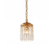 Mini crystal pendant lamp with an antique burnished brass finish.