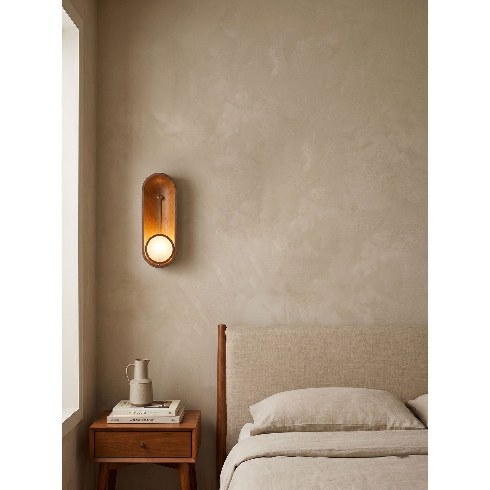 Angled view of the Aperture Wall Sconce showcasing its mid-century modern aesthetic.