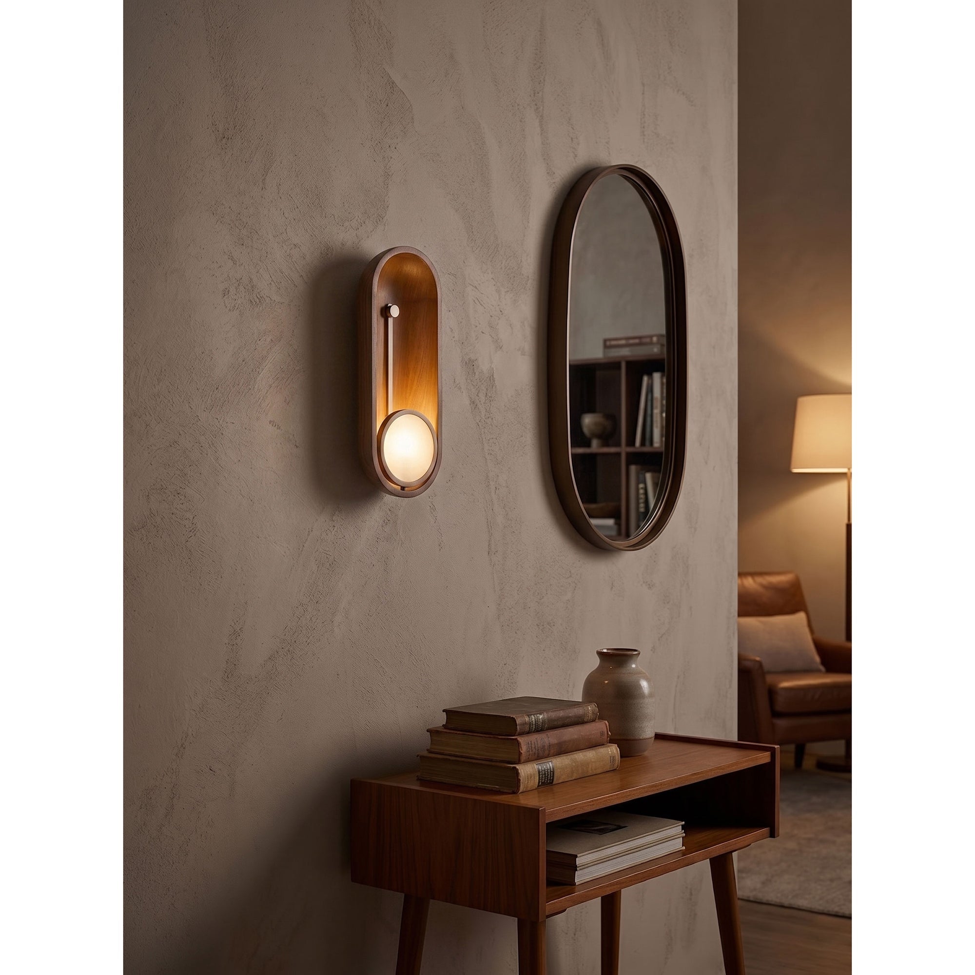 Top-down view of the sconce, emphasizing its elongated capsule form.
