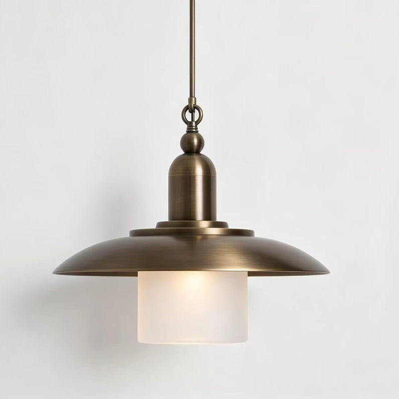Argent Pendant Lamp, nickel finish, over a small round table.