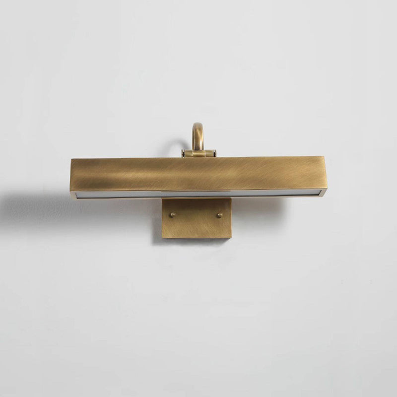 Arti Brass Wall Sconce installed above a painting.