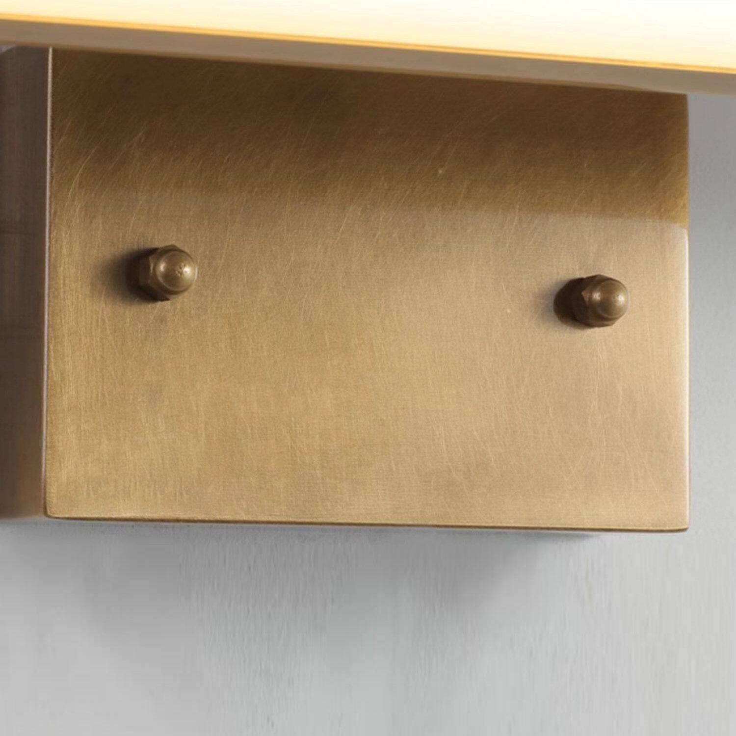 The warm glow of the Arti Wall Sconce.