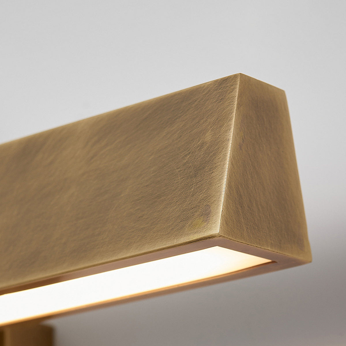 Installation view of the Arti Wall Sconce over a mantel.