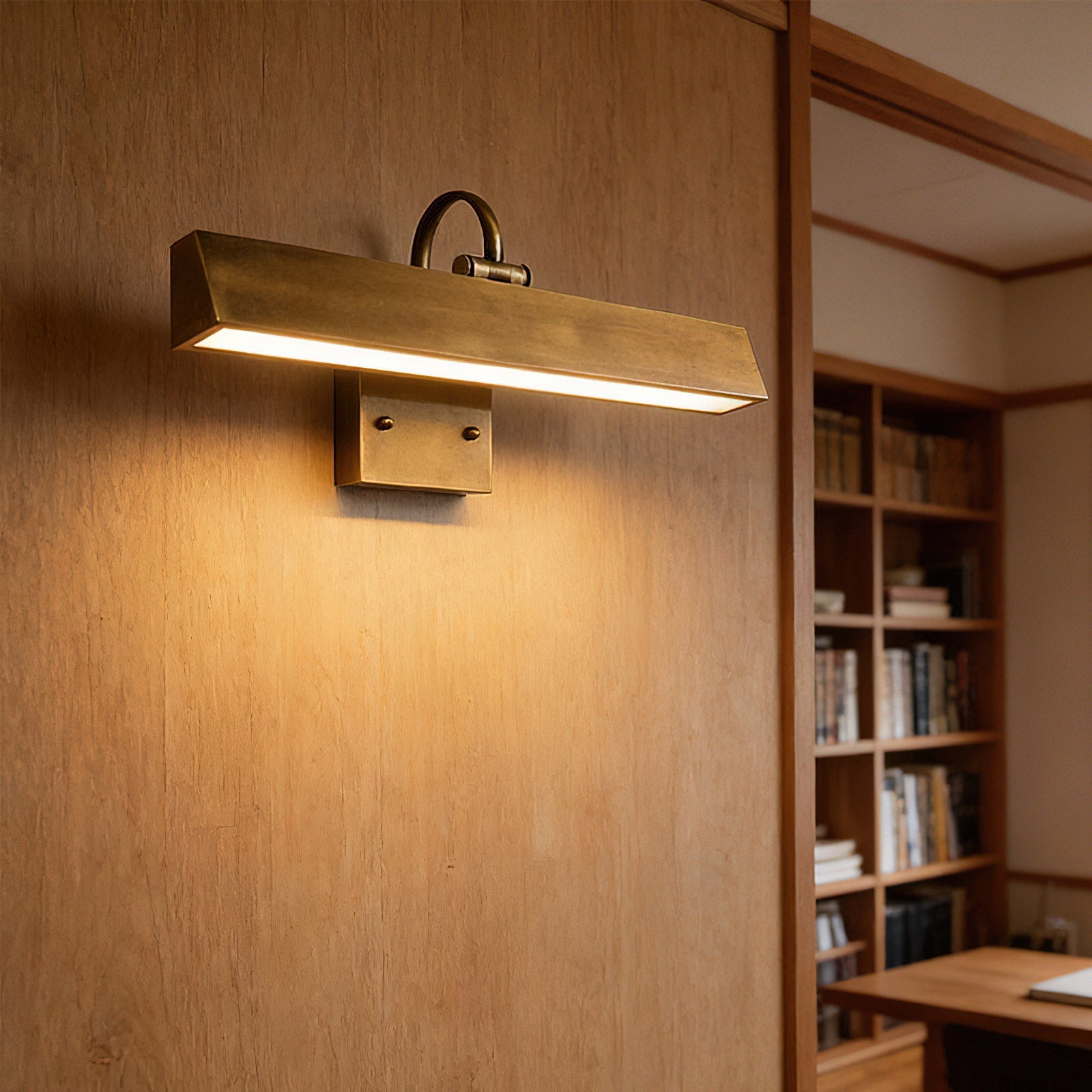 Close-up of the antique brass finish on the Arti Wall Sconce.