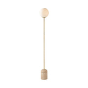 Aseneth Travertine Floor Lamp with frosted glass globe shade.