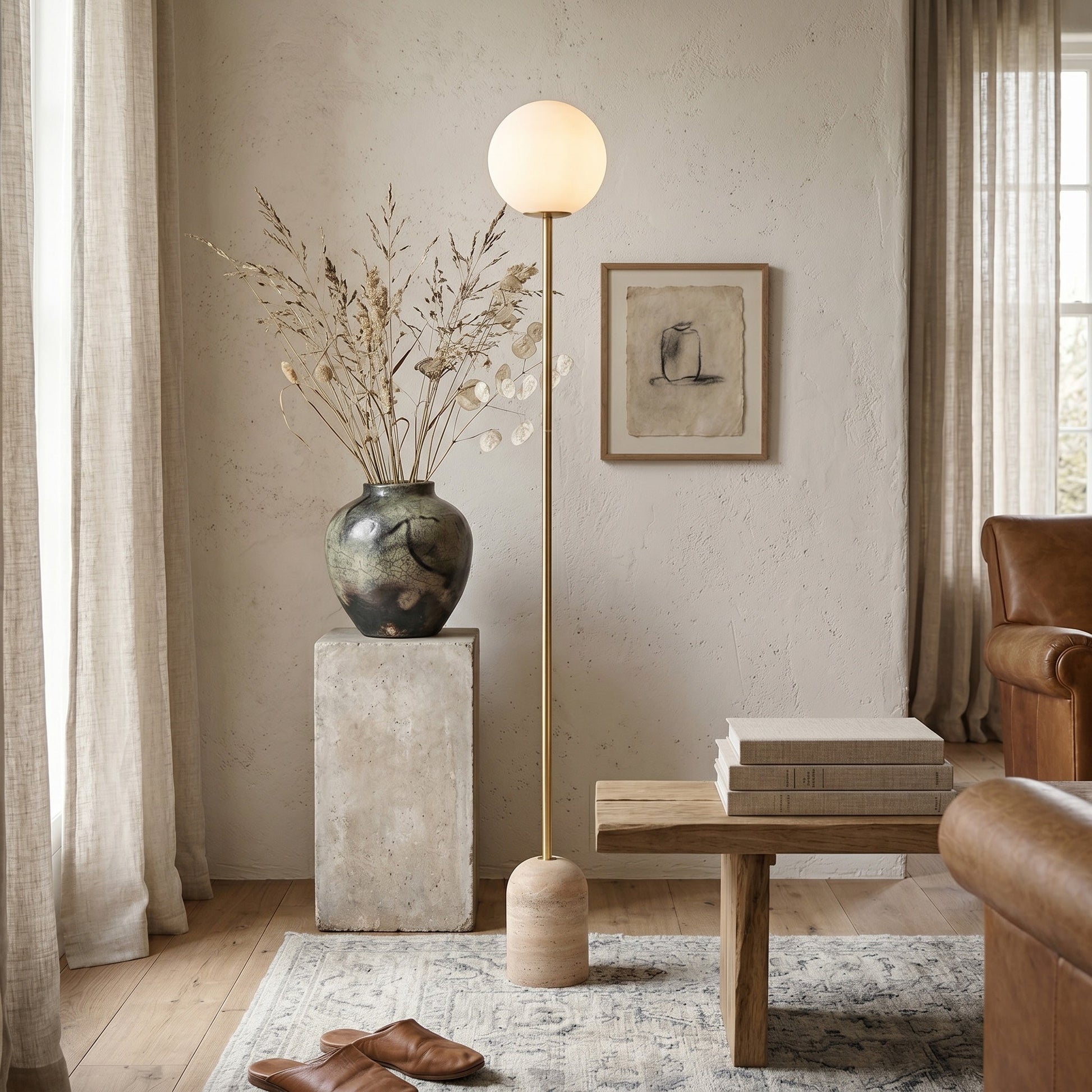 Aseneth Travertine Floor Lamp shown in a minimalist living room setting.
