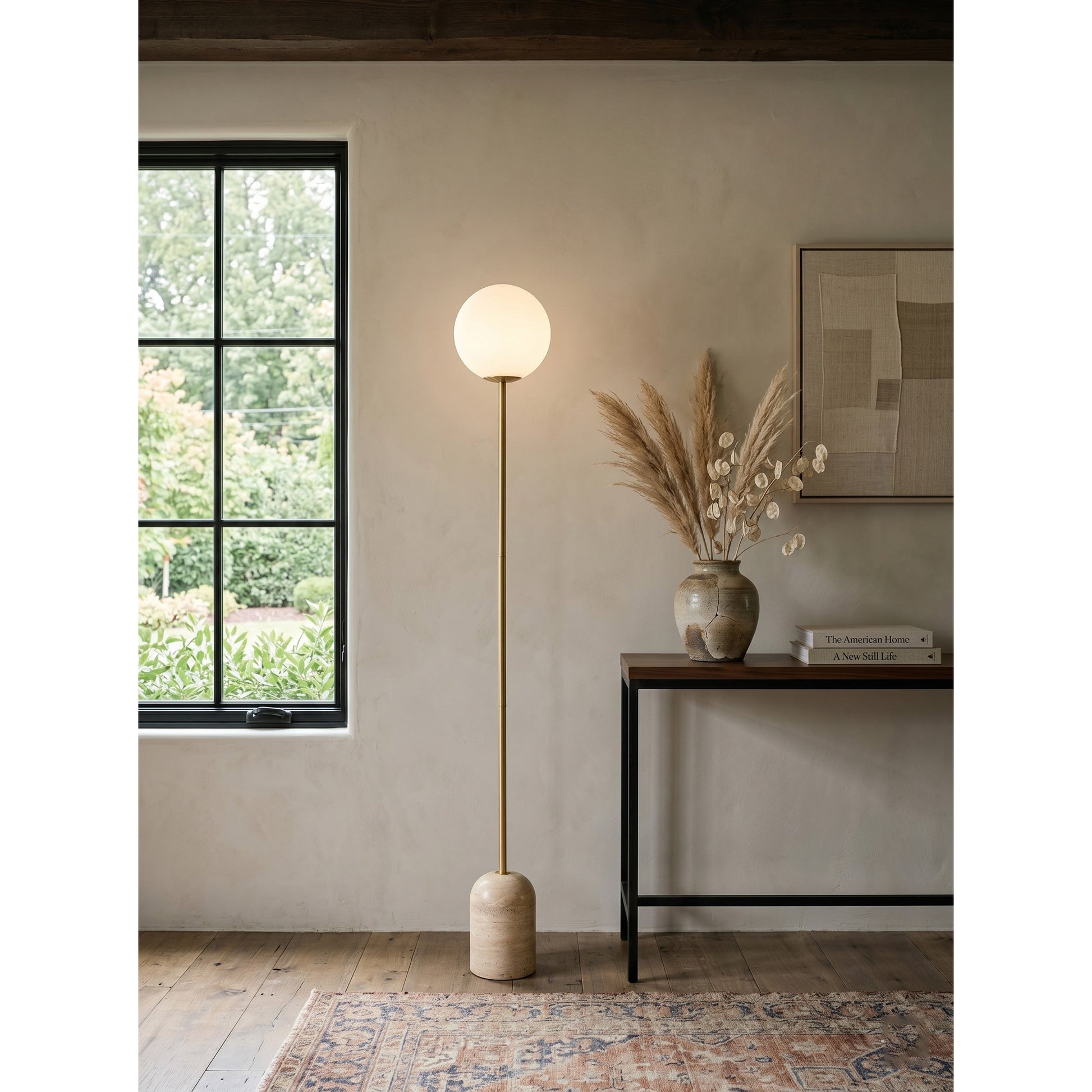 The floor lamp illuminating a reading nook.