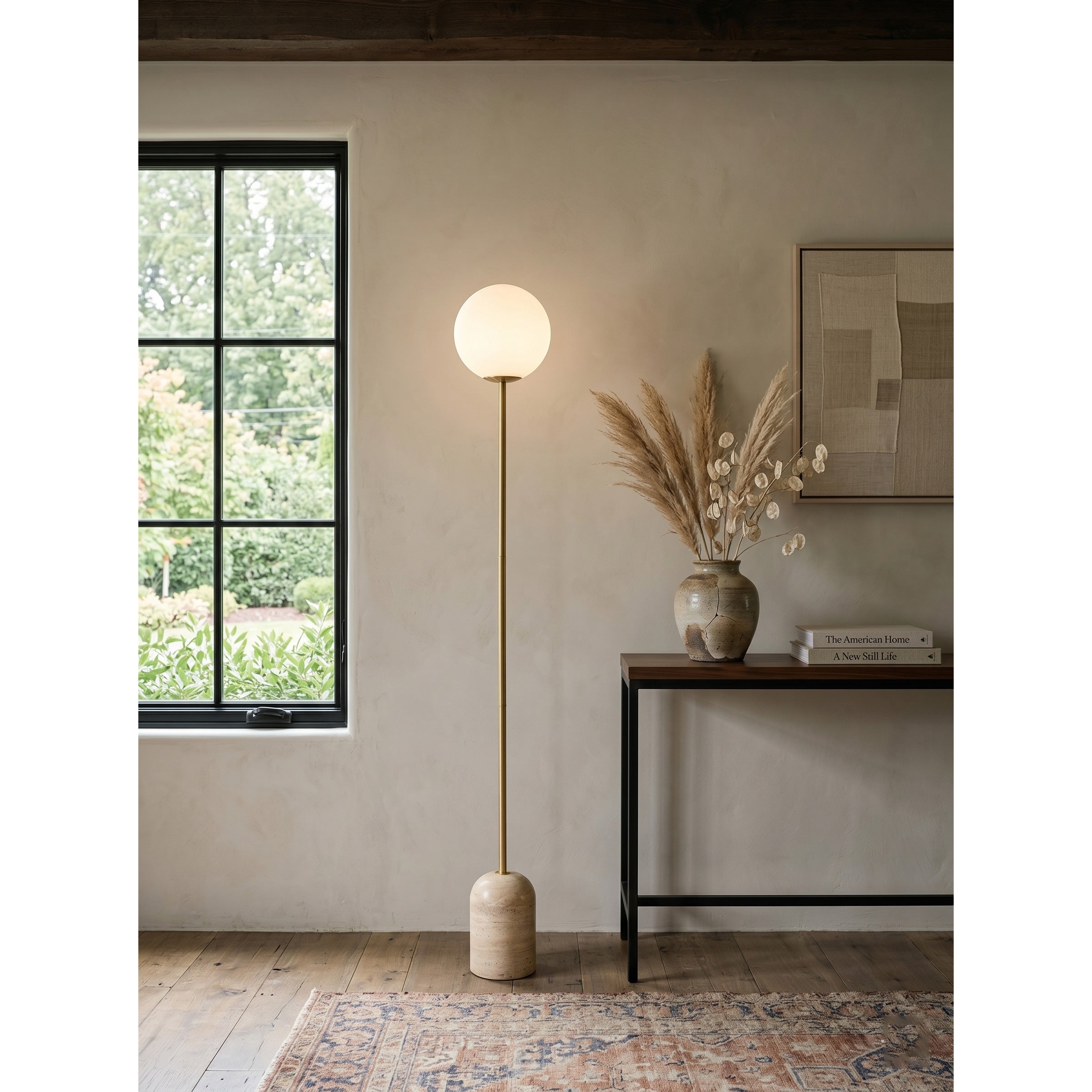 The floor lamp illuminating a reading nook.