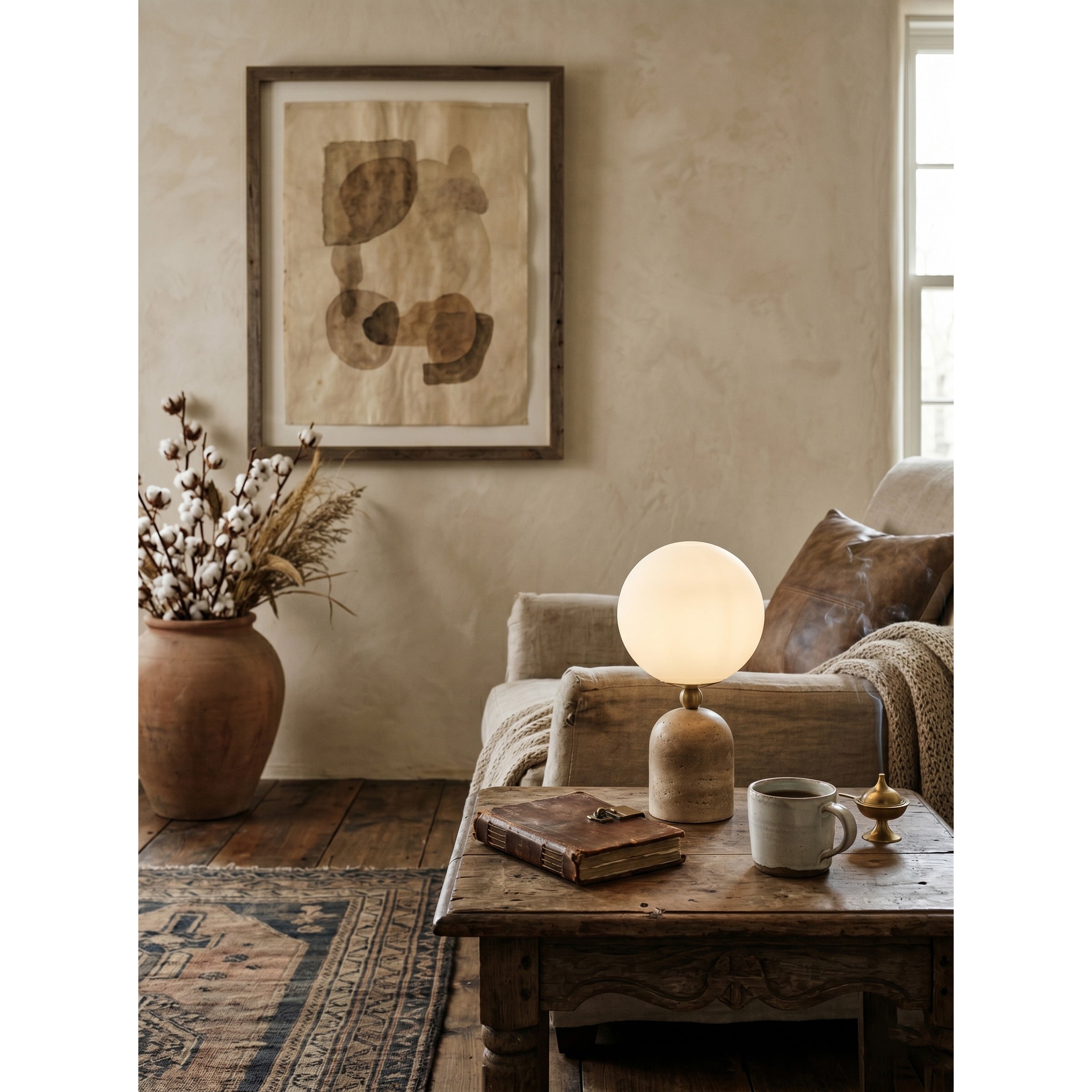Aseneth Travertine Table Lamp on an entryway console table.