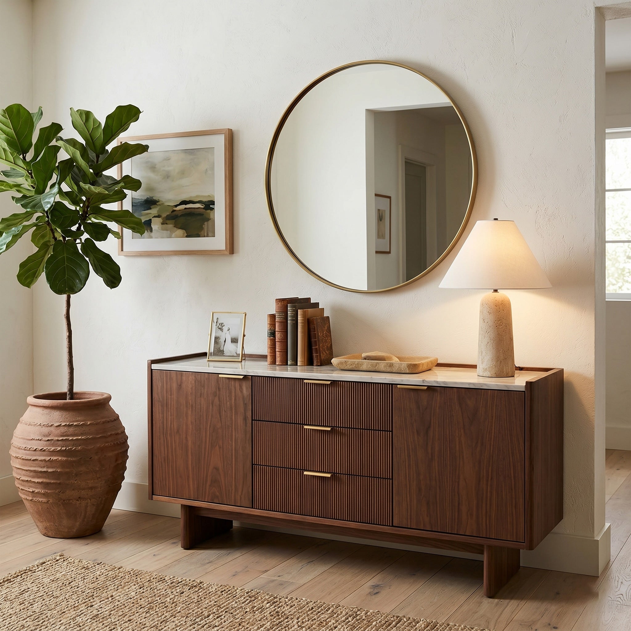 Astere Travertine Table Lamp displayed on an entryway console table.