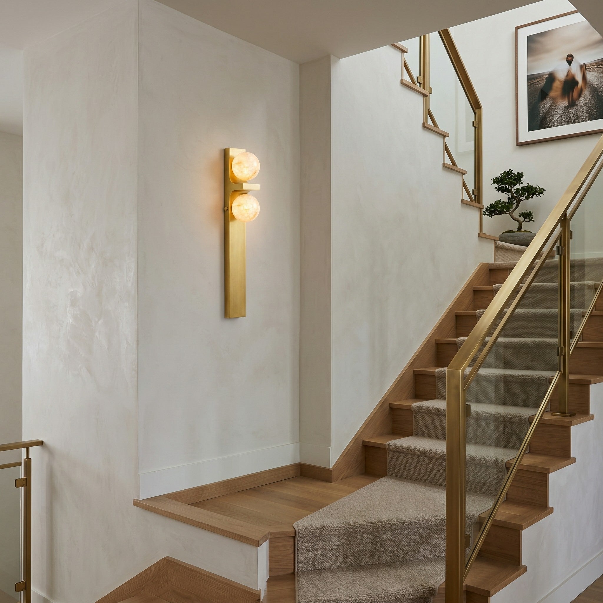 Side angle view of the sconce, showcasing its asymmetrical design.