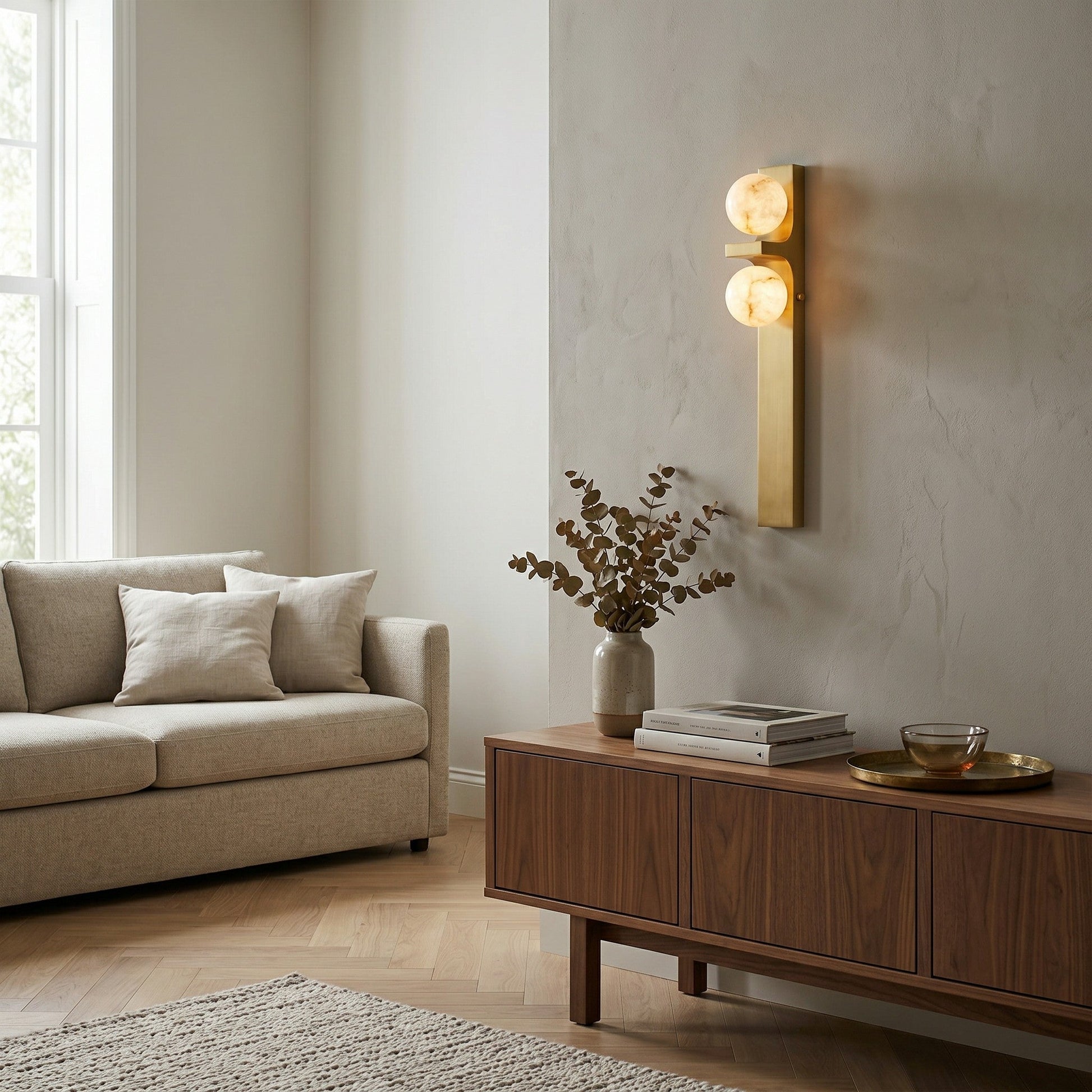 Lifestyle image of the sconce installed beside a bed in a modern bedroom.