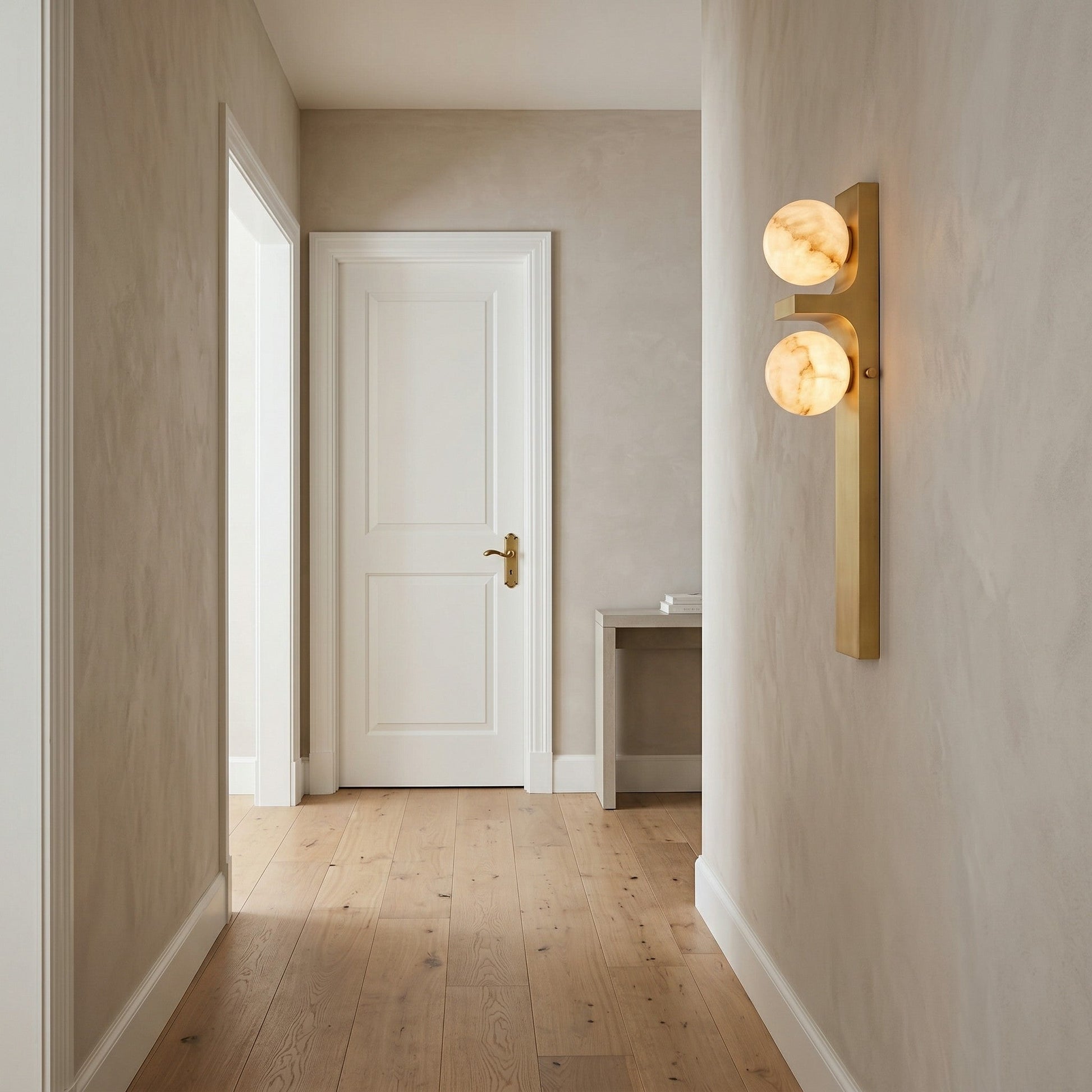 The asymmetrical wall sconce in an entryway, providing a welcoming glow.