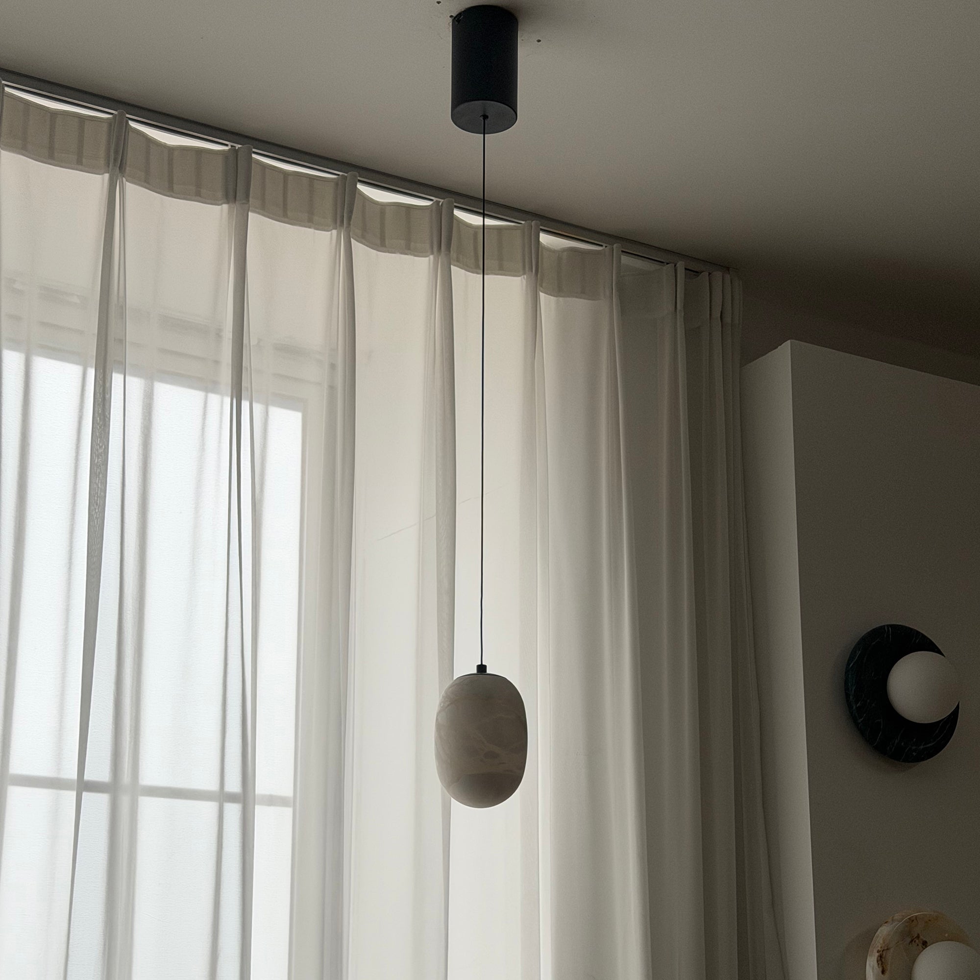 Bottom view of the pendant, showing the integrated LED light source.
