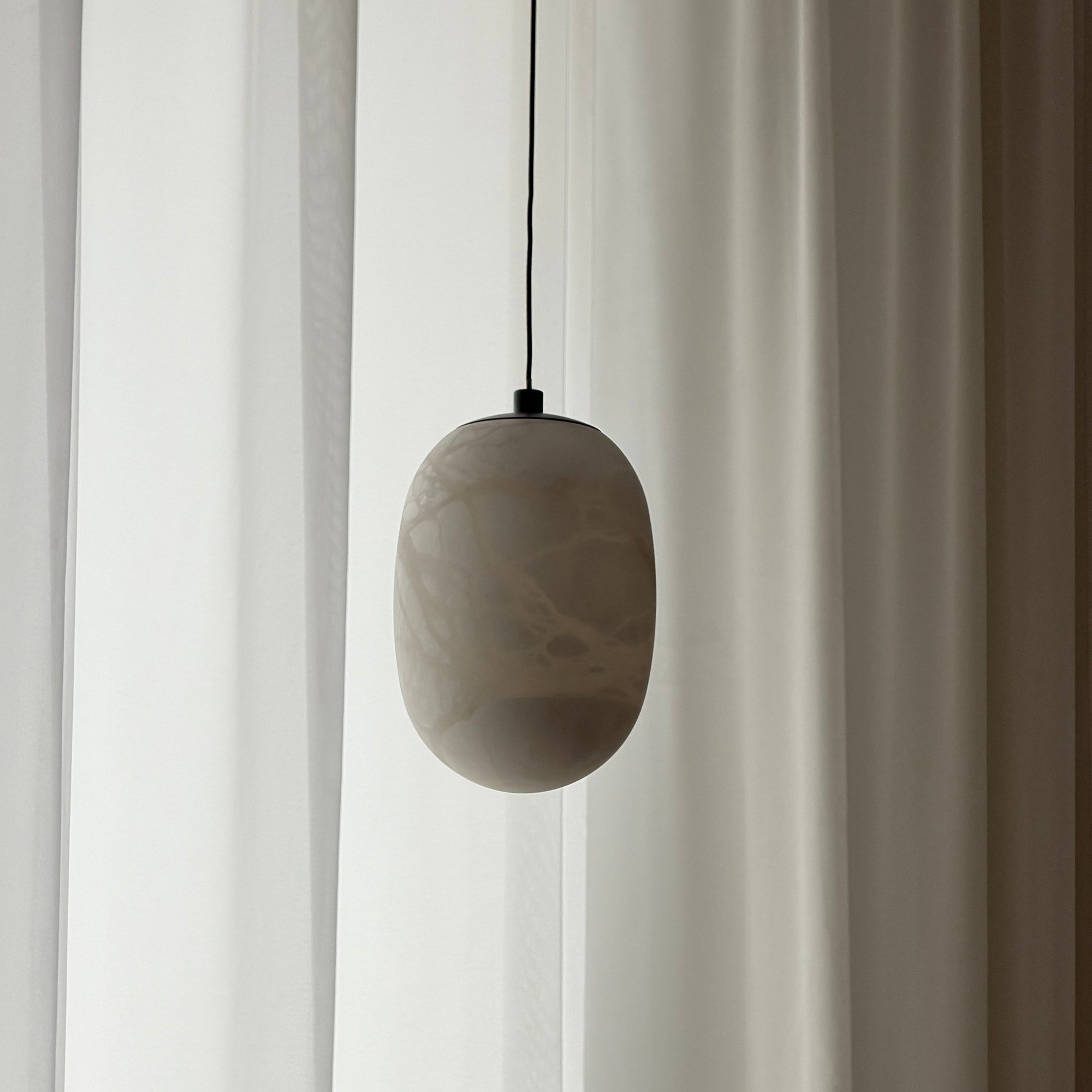 The unique texture of the alabaster material in natural light.