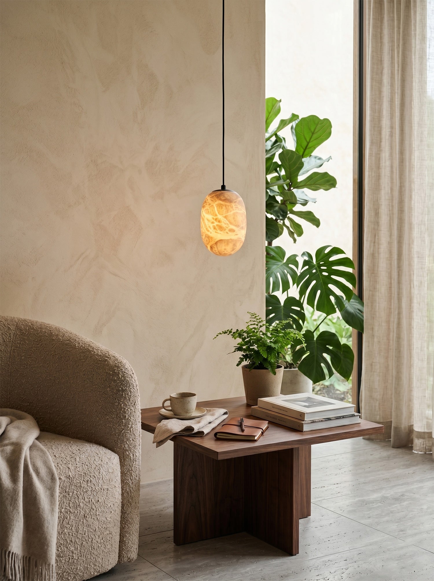 Side view of the organically shaped alabaster pendant.