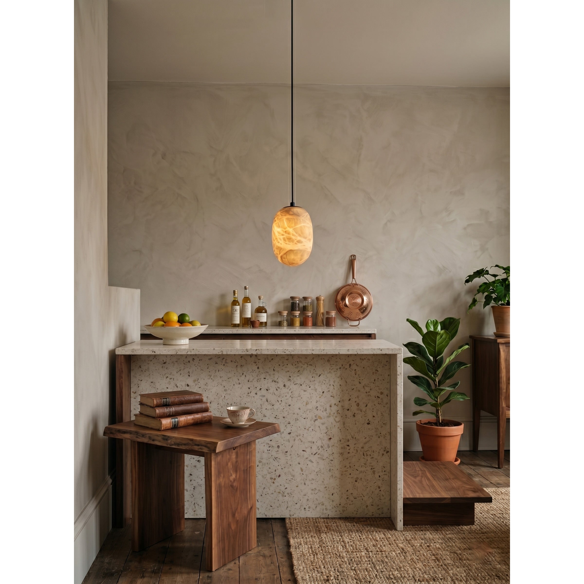 A pair of Aurora pendants hanging over a modern kitchen island.