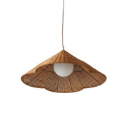 Bardi Scalloped Rattan Pendant Lamp hanging in a bright living room.
