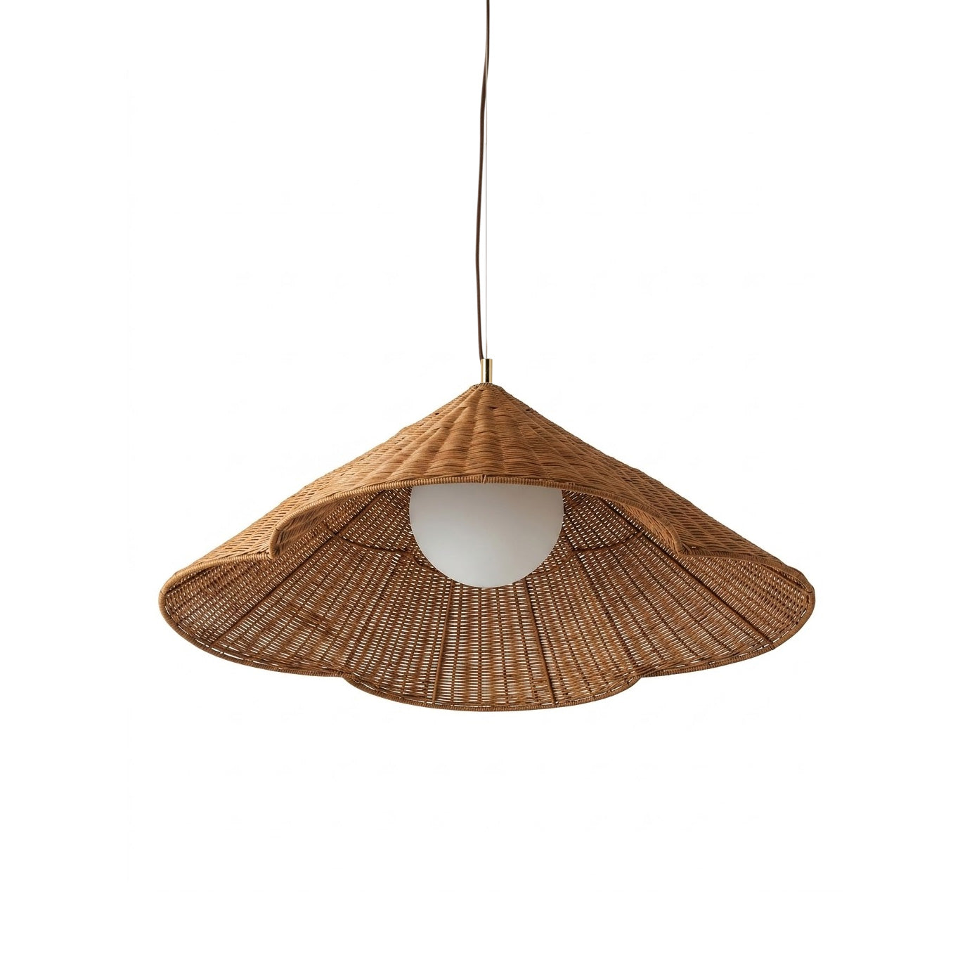 Bardi Scalloped Rattan Pendant Lamp hanging in a bright living room.