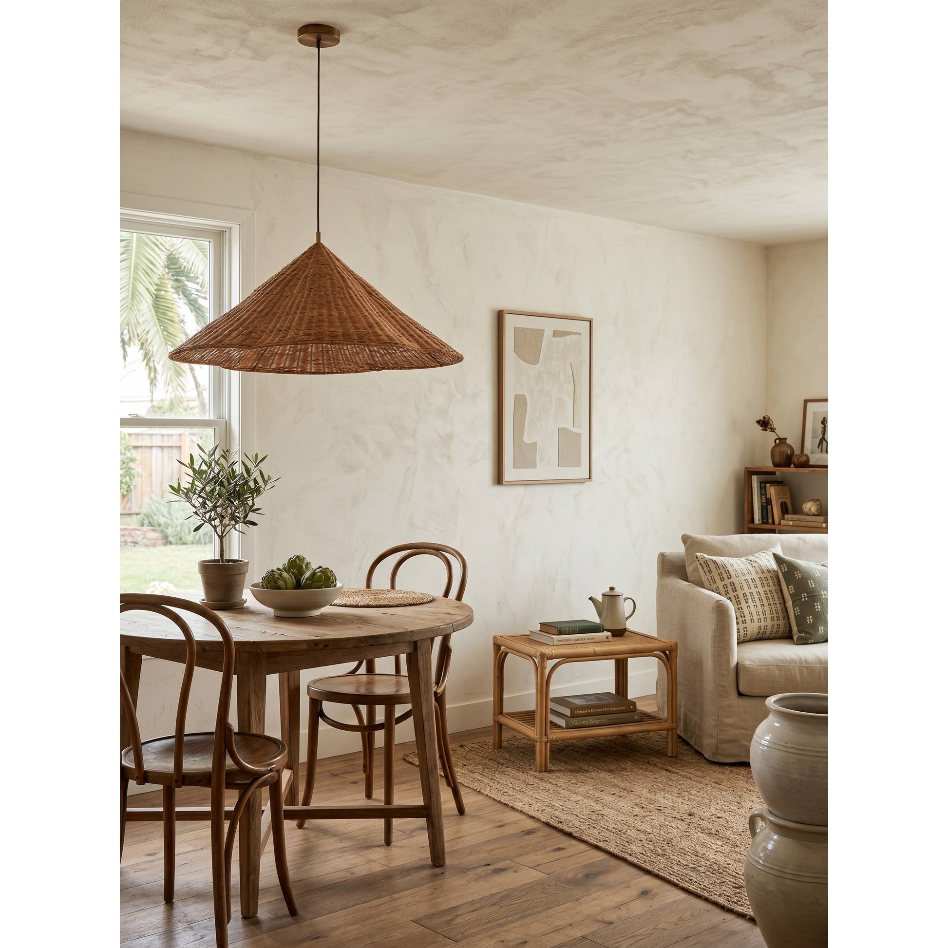 Lifestyle image of the lamp in a coastal-style bedroom.