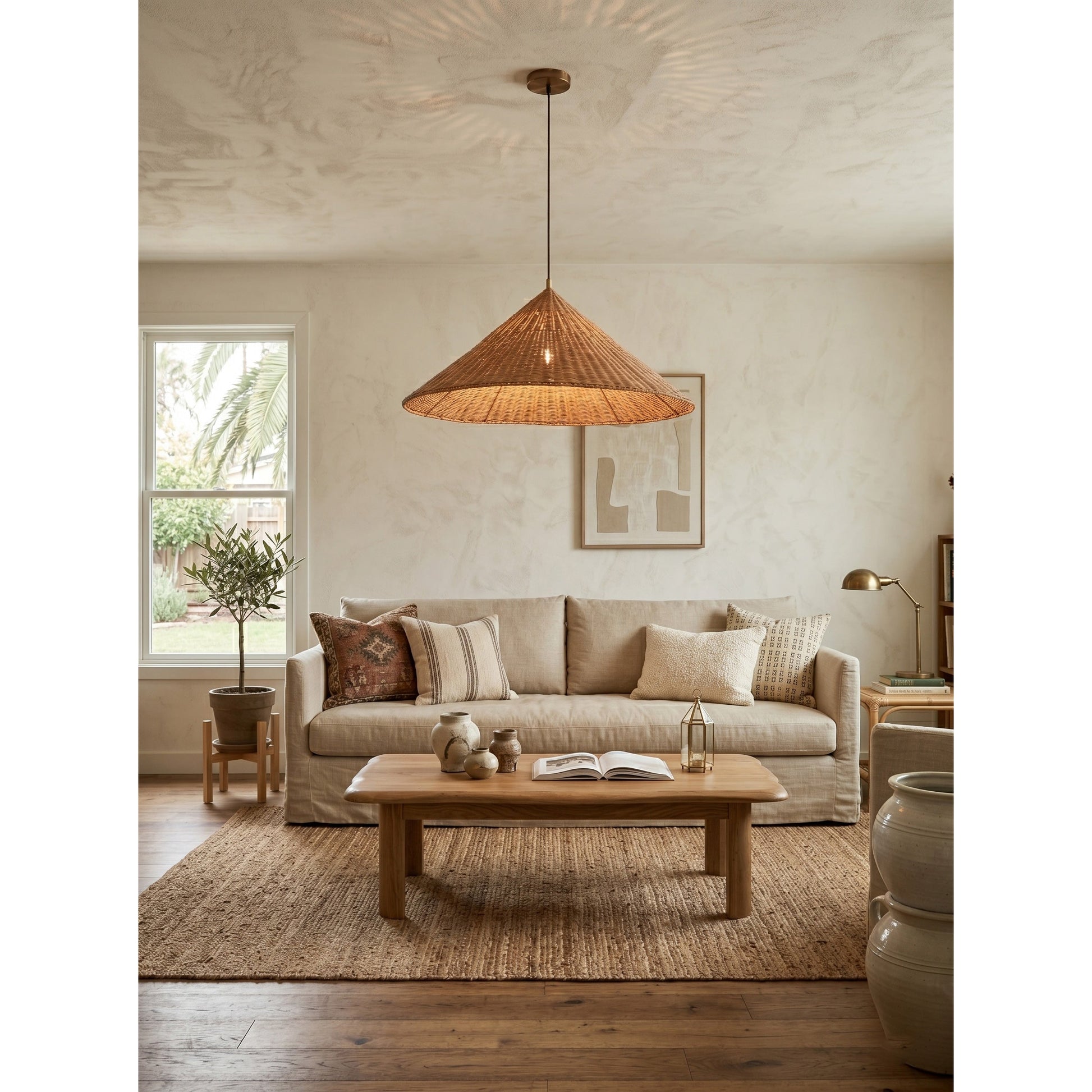The pendant lamp casting a warm, patterned light on the ceiling.