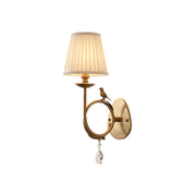Front view of the Bird Fabric Wall Sconce with its pleated beige shade.