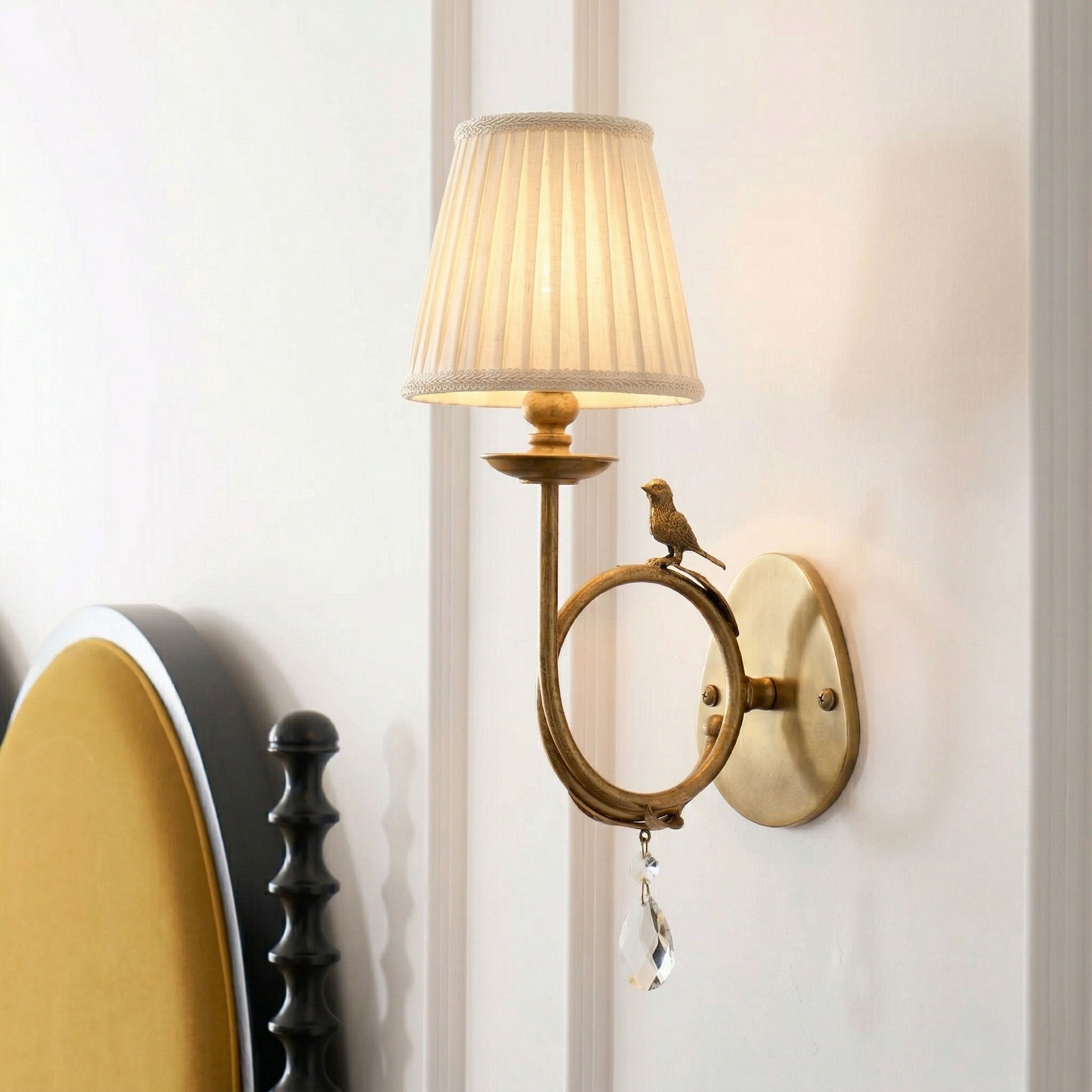 A pair of Bird Fabric Wall Sconces beautifully flanking an entryway mirror.
