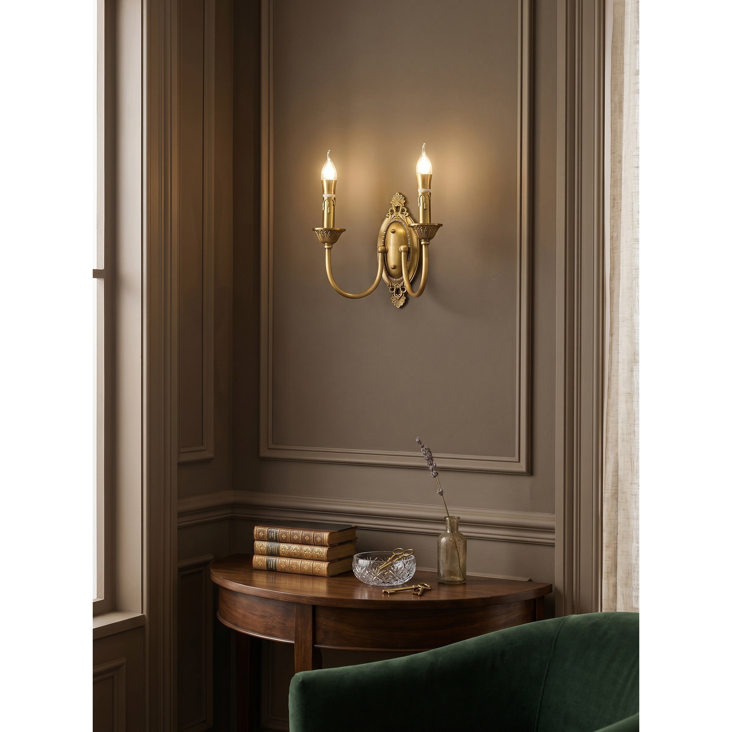Angled view showcasing the depth and ornate details of the antique brass sconce.
