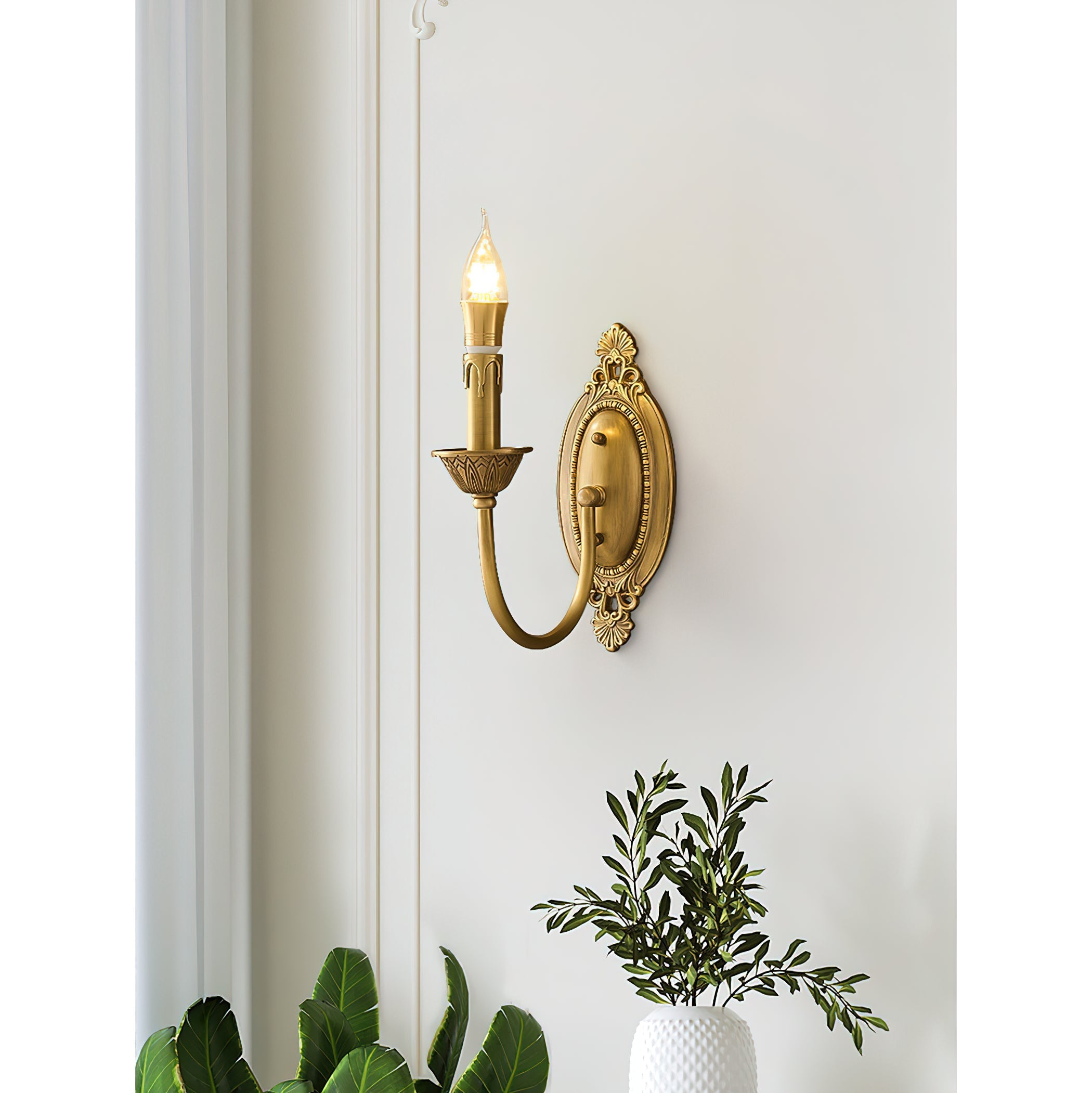 Lifestyle image of the sconce in a traditionally decorated living room.