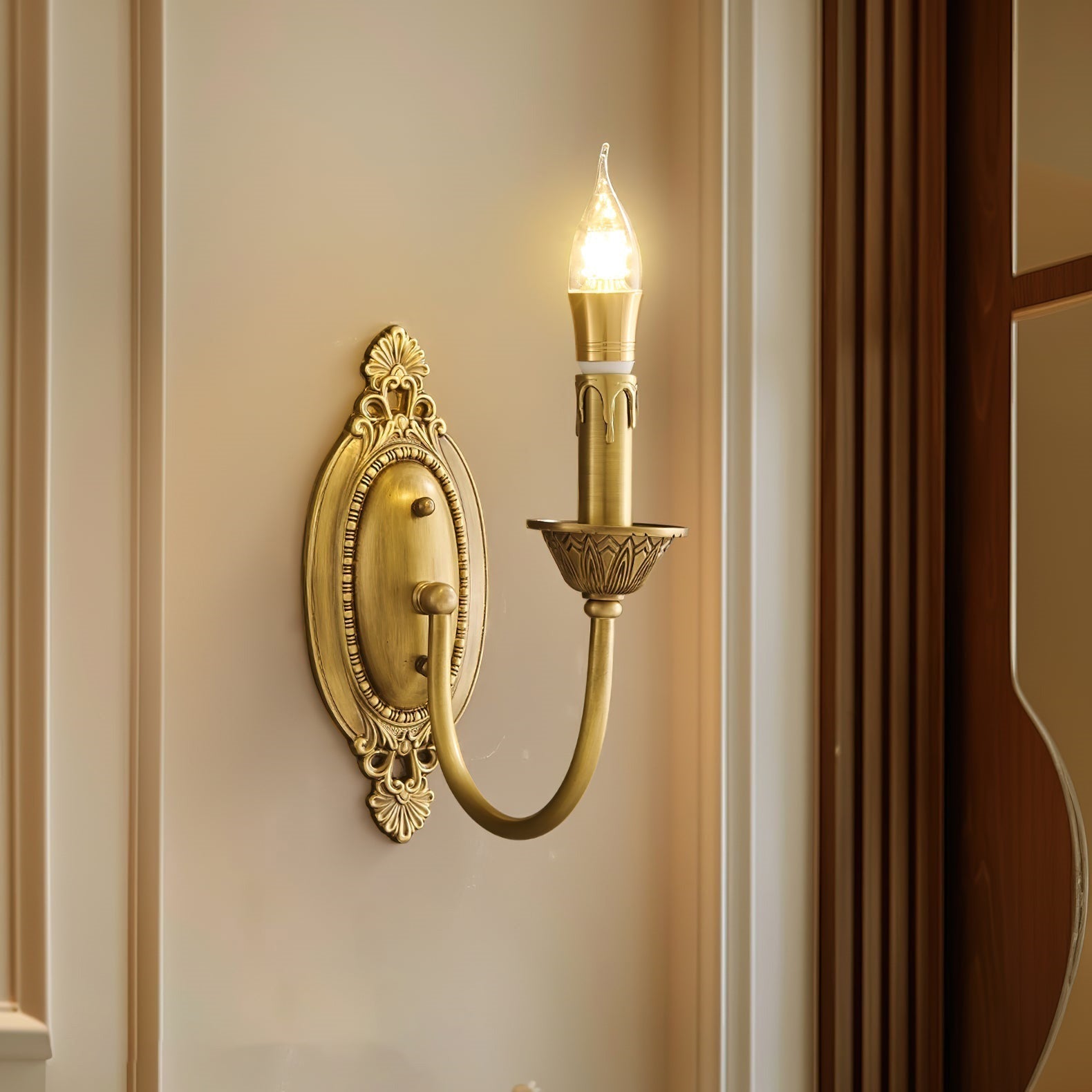 Close-up of the ornate oval backplate and filigree detail on the Blair Sconce.