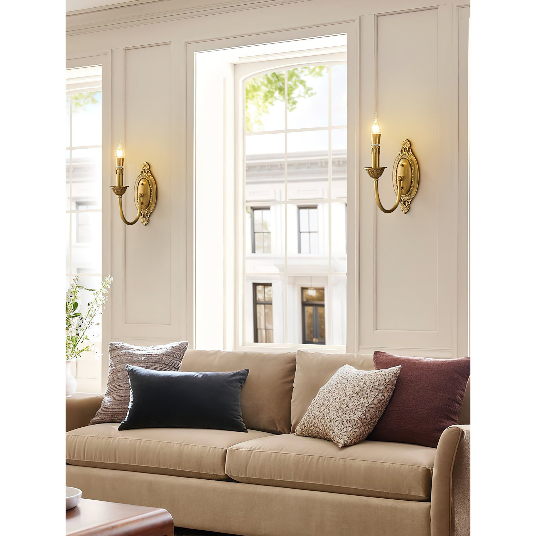 Blair Candle Wall Sconces providing ambient light in an elegant dining room.