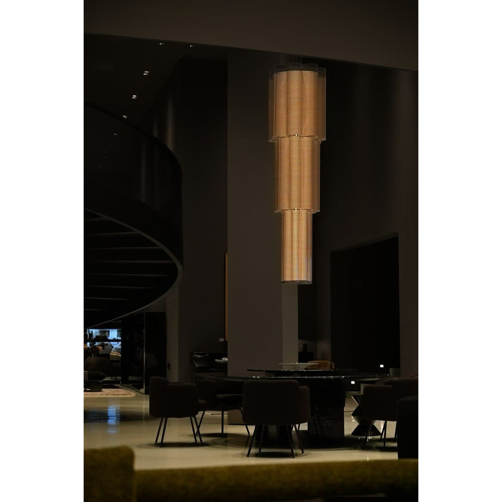 The chandelier shown unlit to display the reflective stainless steel finish.