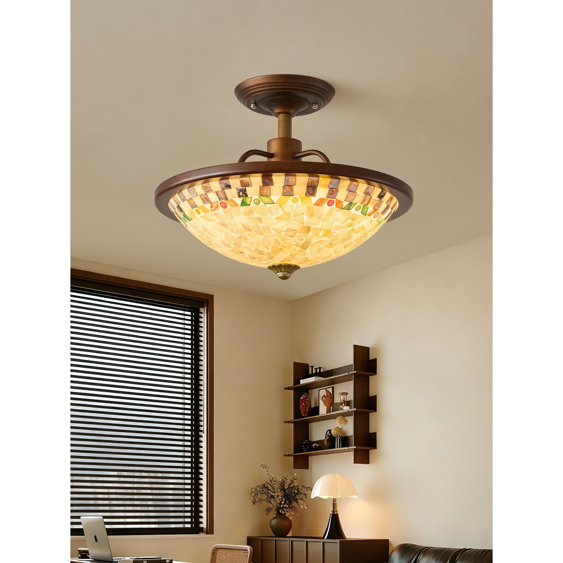 Close-up on the abalone shell mosaic details within the lampshade.