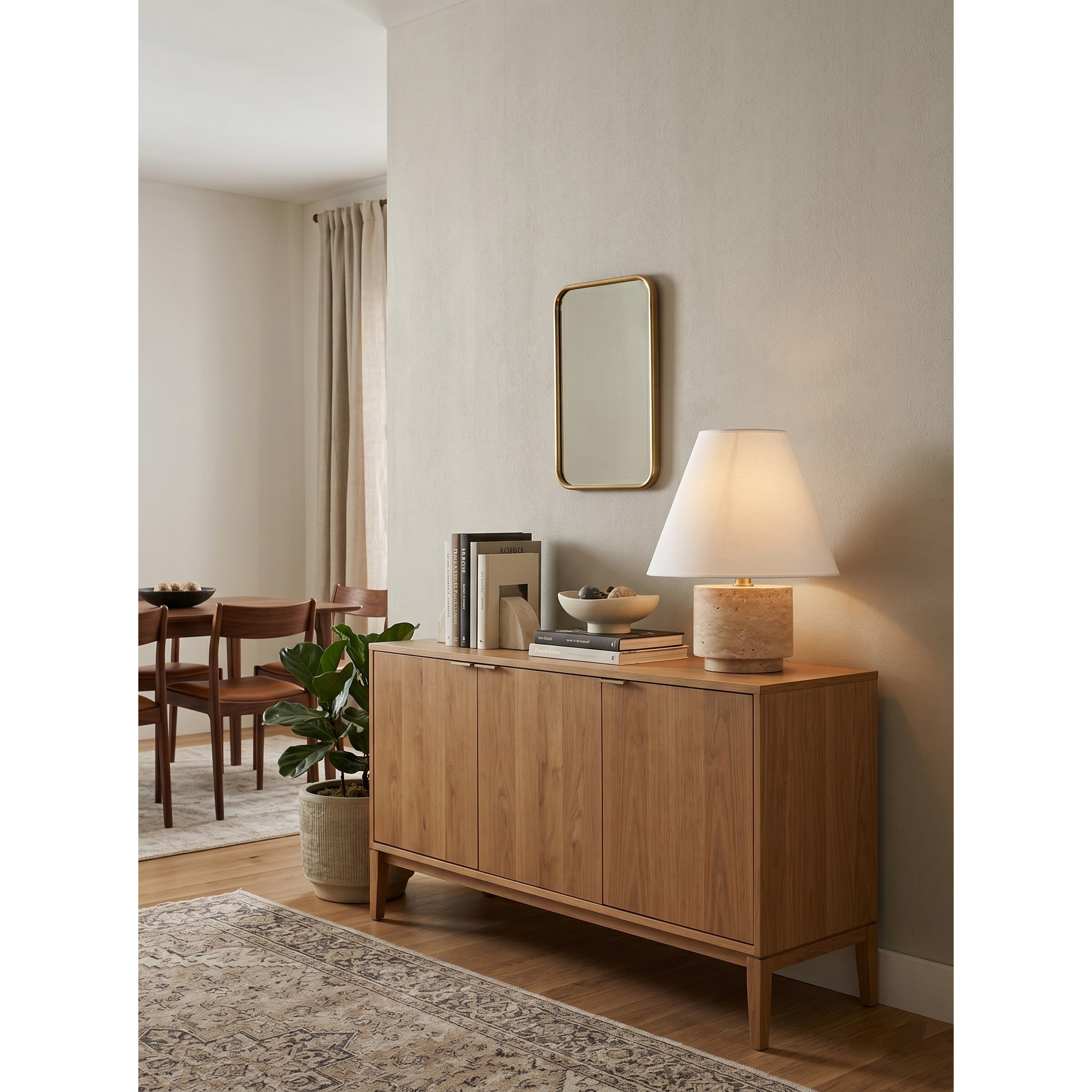The flared empire linen shade of the Bronte Table Lamp.