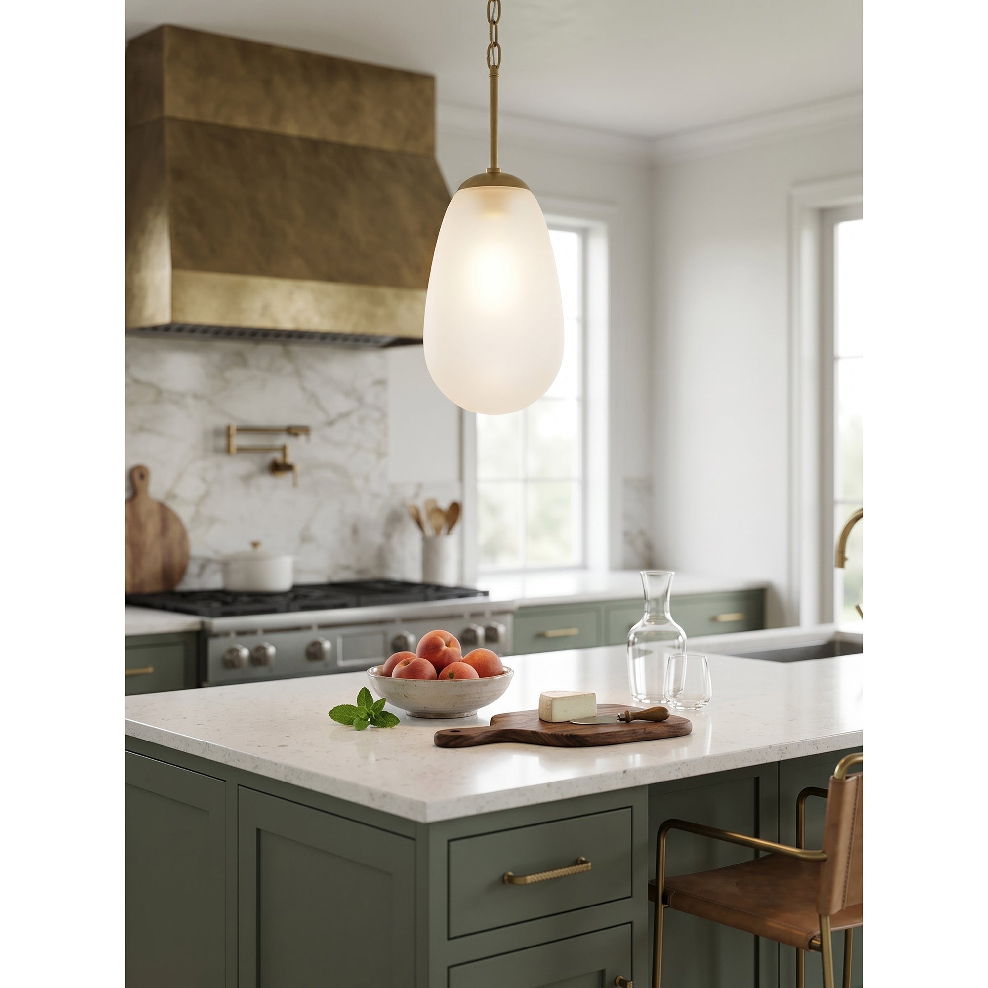 Bruckner Pendant Lamp with brass finish in a dark, moody interior.