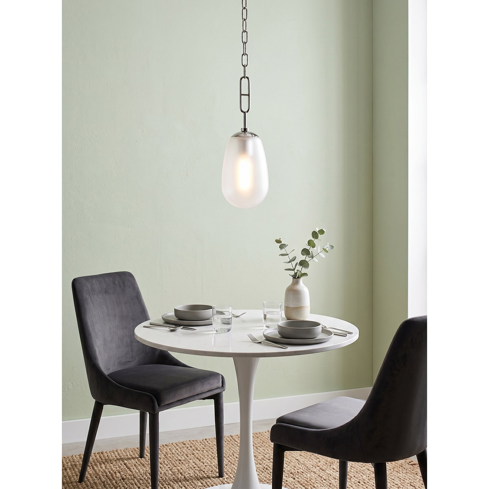 Bruckner Pendant Lamp with black finish in a light and airy room.