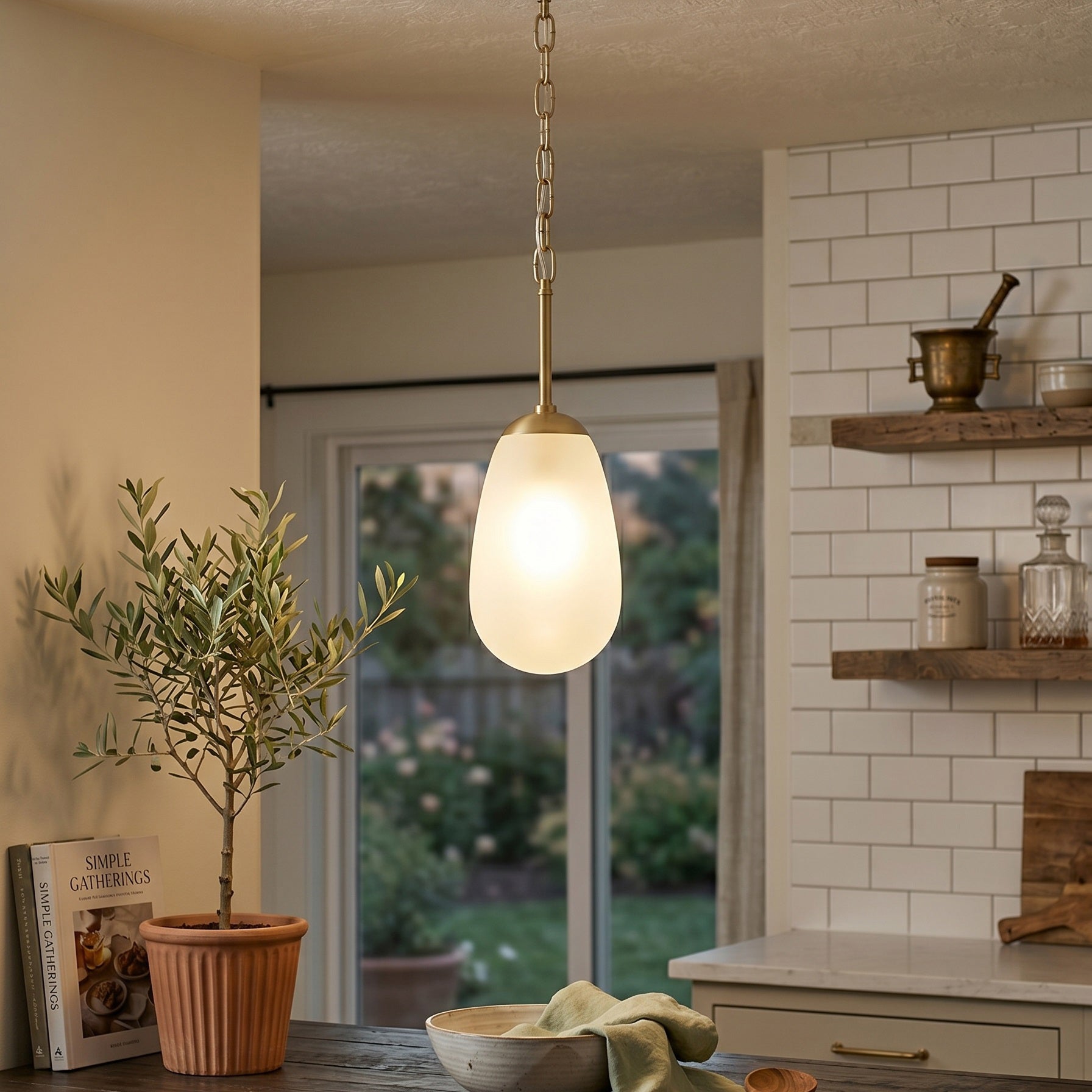 The Bruckner Pendant Lamp casting a soft, ambient glow in a living space.