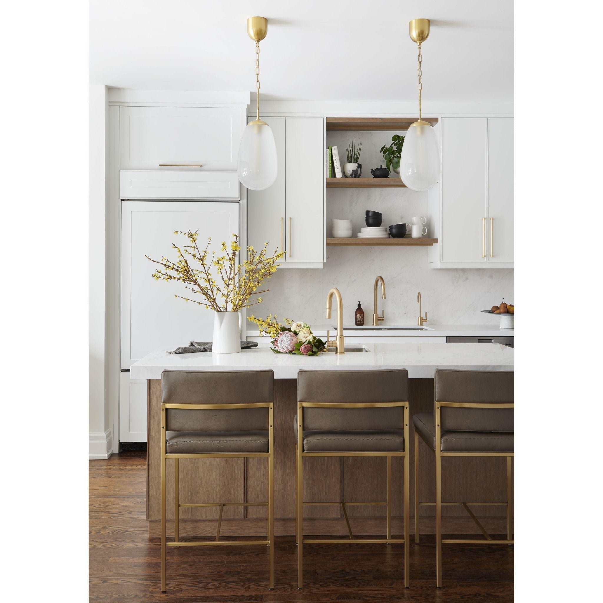 Two Bruckner Pendant Lamps installed on either side of a bathroom vanity mirror.
