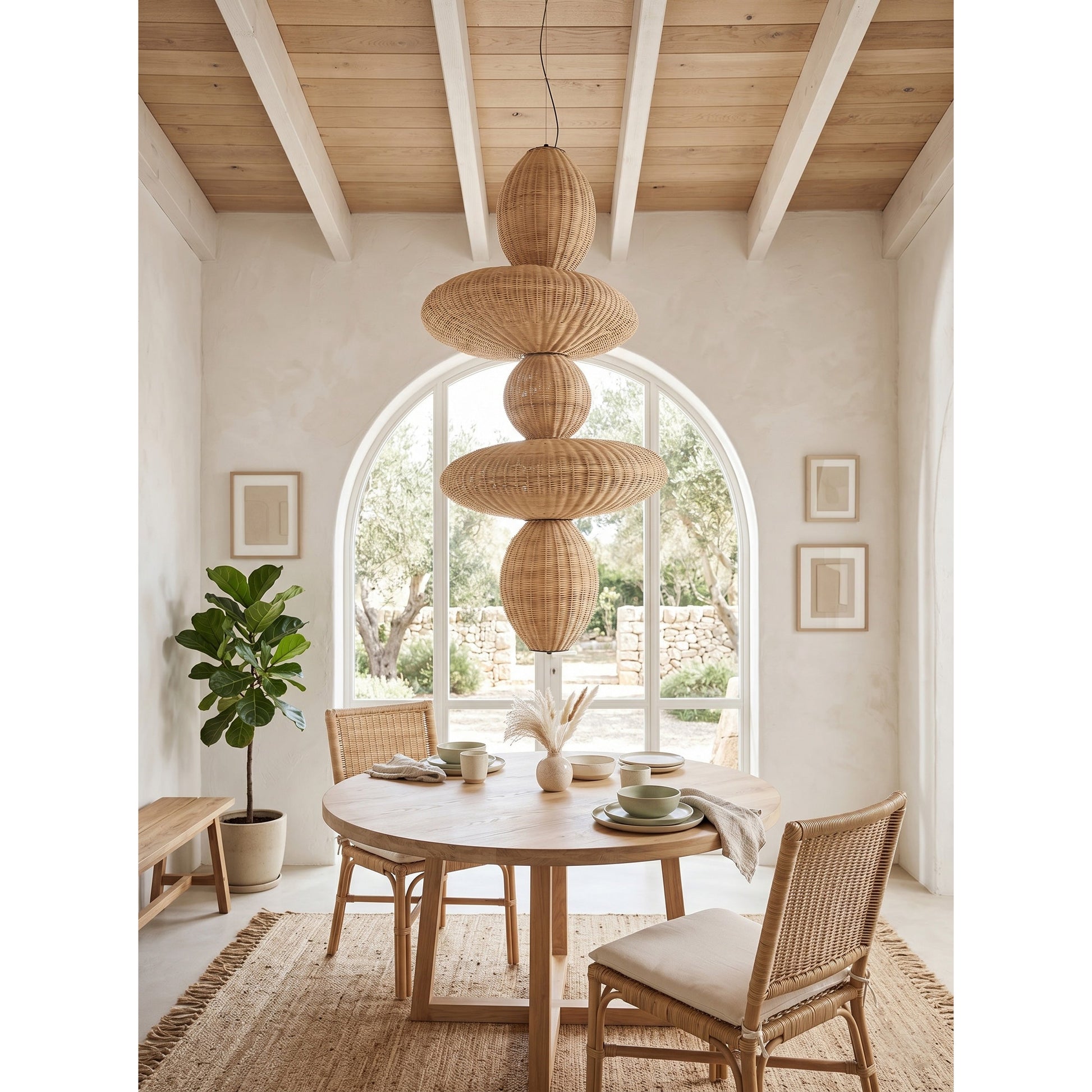 The chandelier featured in a coastal-themed living room with light, airy decor.