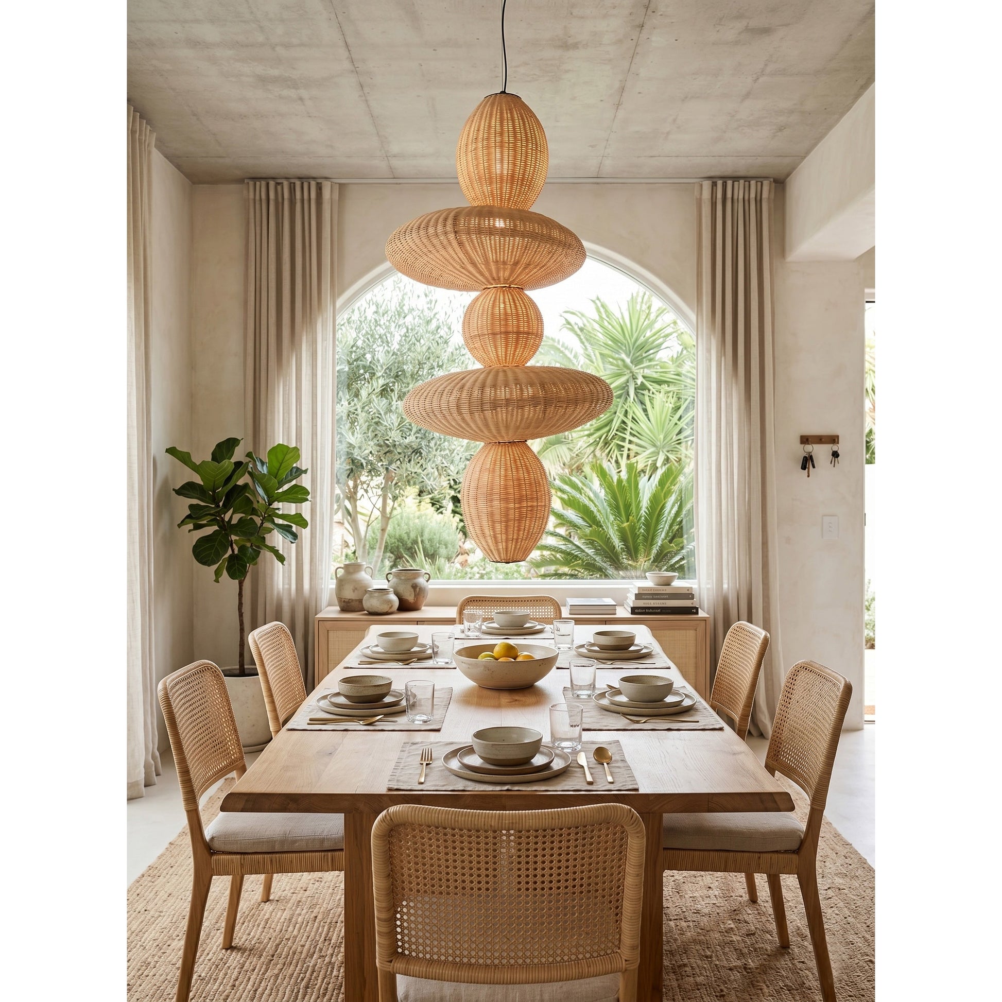 Lifestyle image of the Bubbles Rattan Chandelier creating a cozy ambiance in a home.