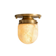 Bullet-shaped alabaster flush mount with a brass base.