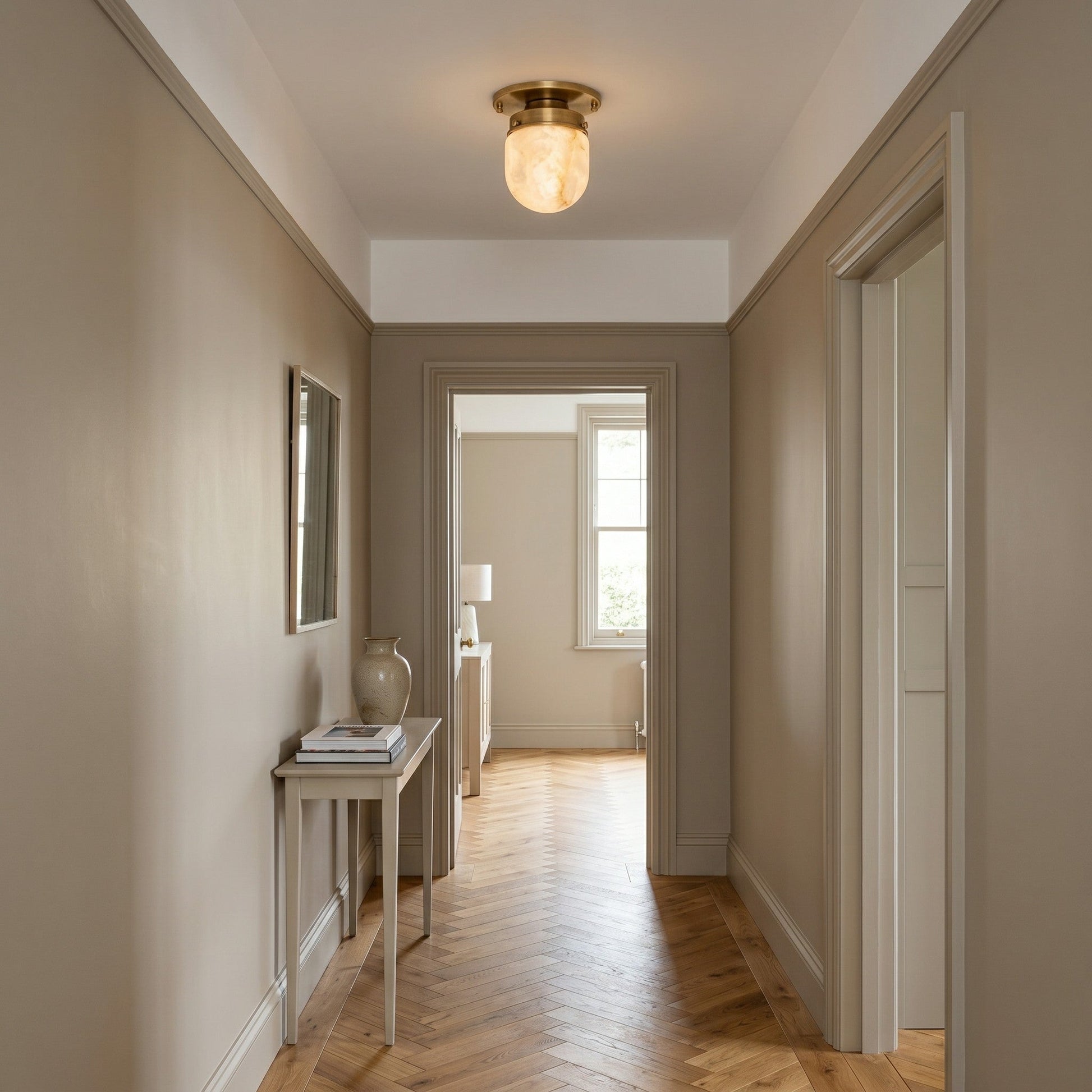 The modern flush mount light installed in a hallway.