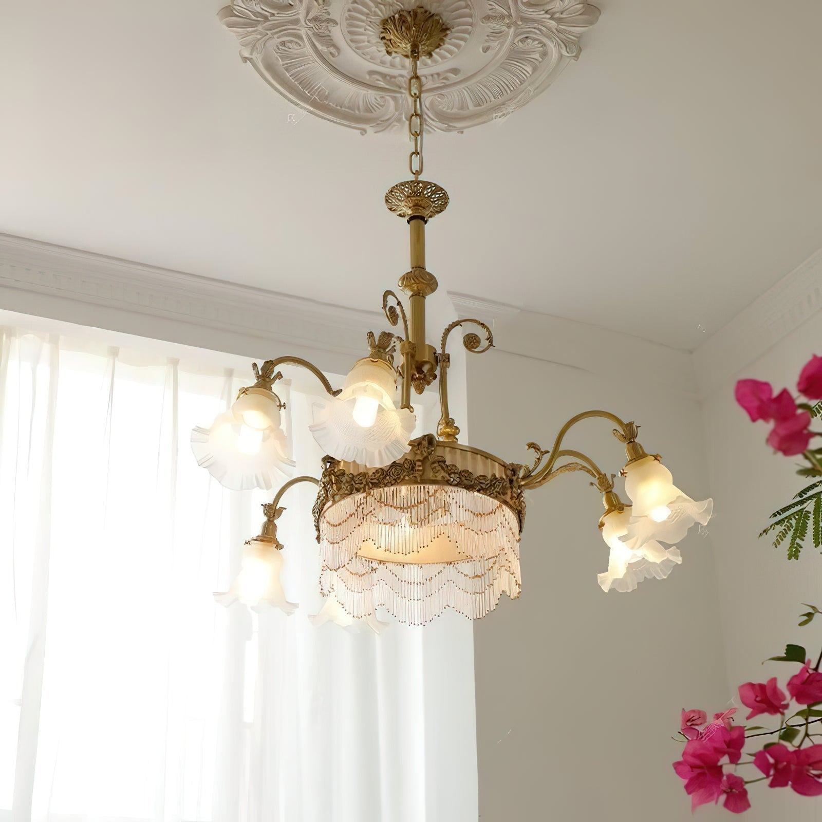 Lifestyle view of the Camille Fringed Chandelier in a sophisticated dining room.