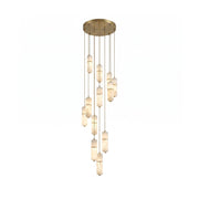 Cannula Alabaster Chandelier with multiple glowing cylinders against a dark background.