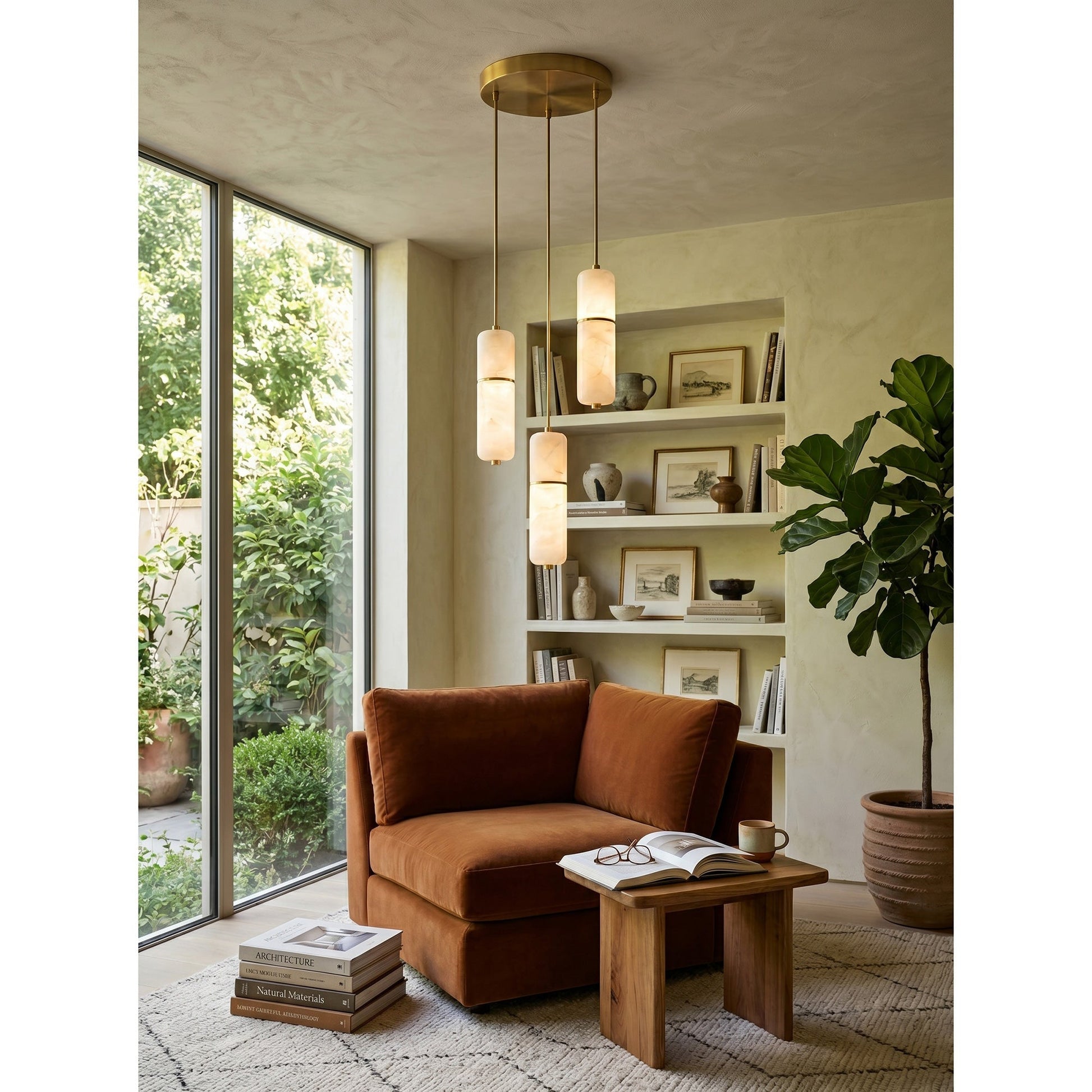 Lifestyle image of the Cannula Chandelier in a luxury dining space.