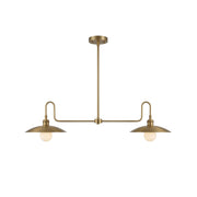 Cantina Linear Chandelier in antique brass finish over a kitchen island.