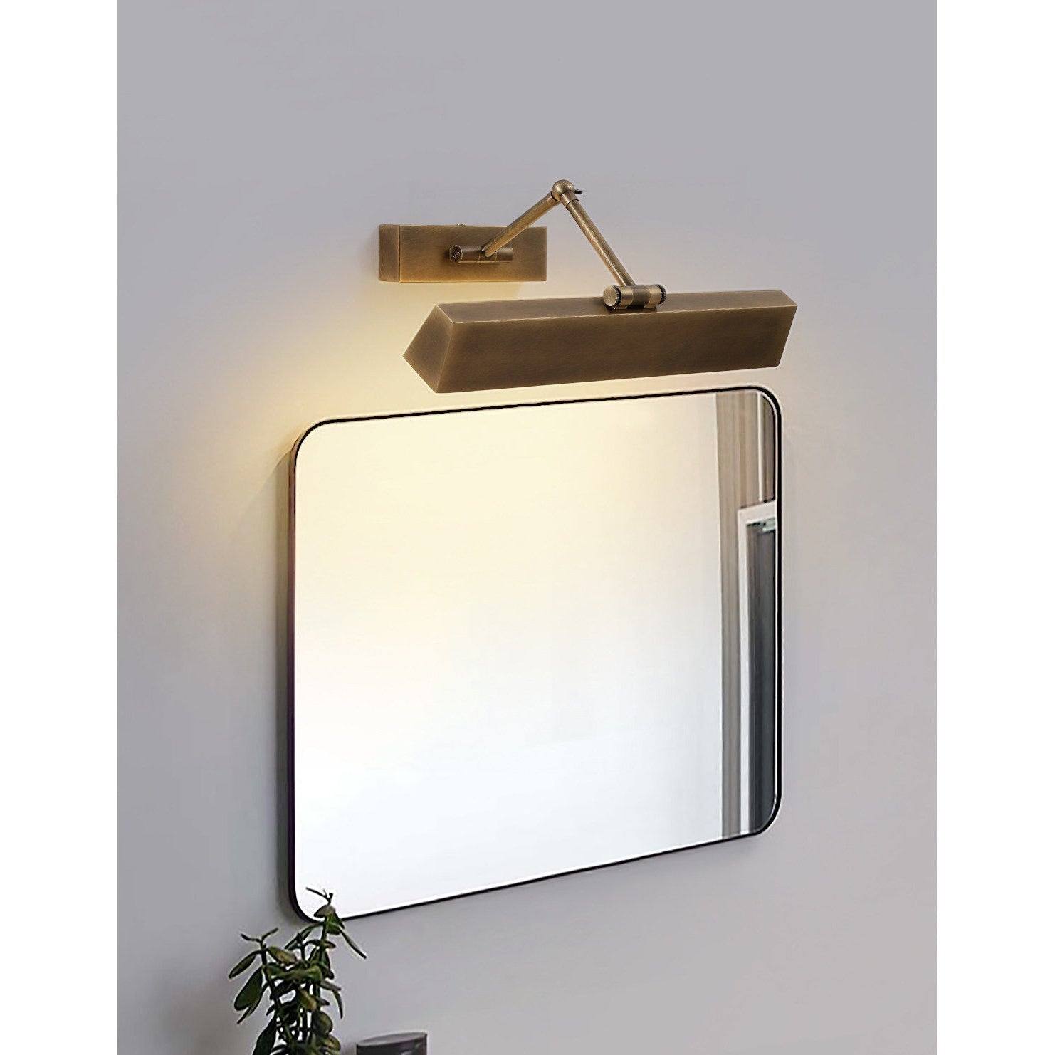 Carlisle wall sconce in a home library setting.