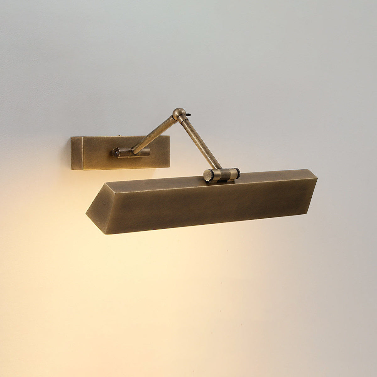 The sconce adjusted to its minimum extension from the wall.
